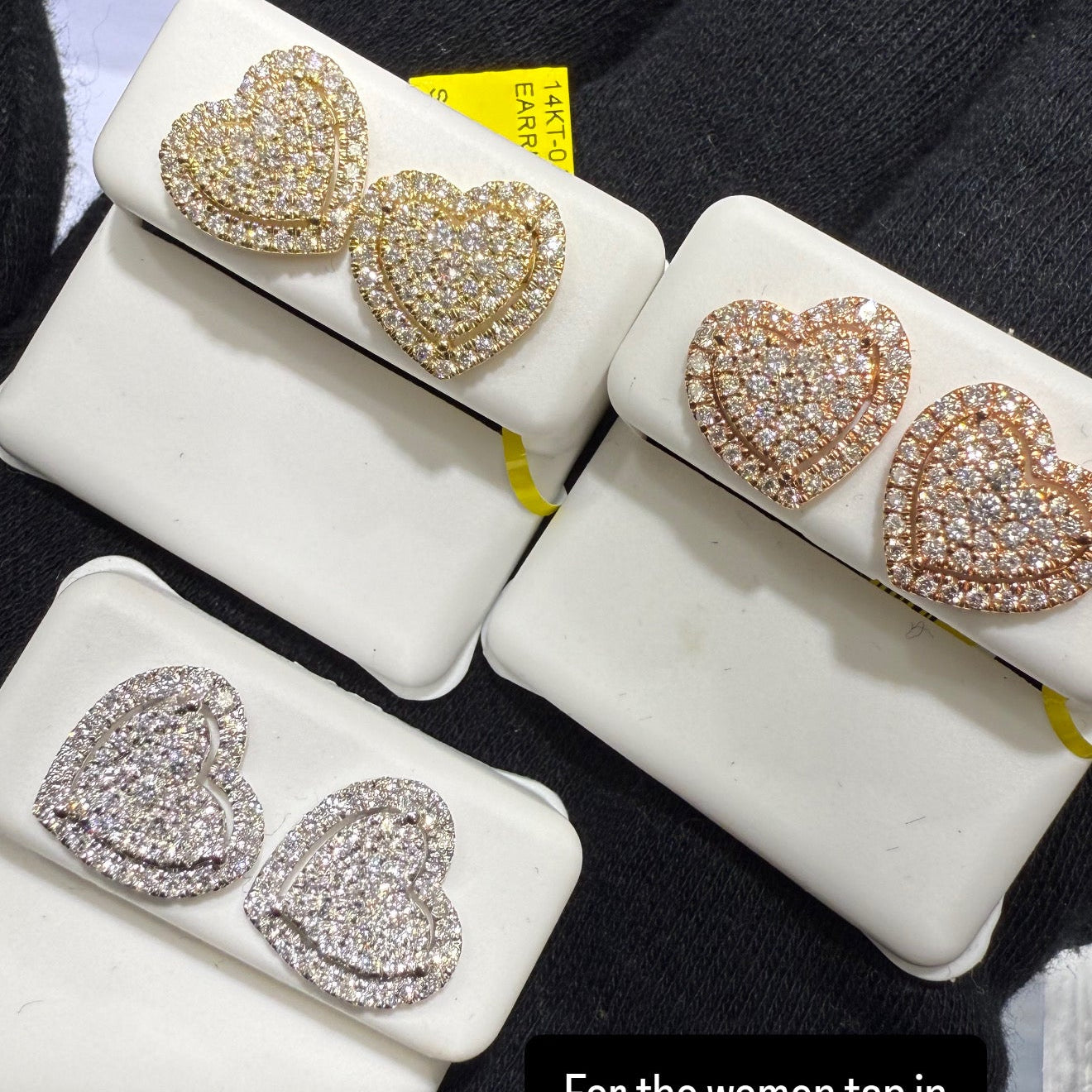 Heart-shaped earrings in white, yellow, and gold on display with text overlay.
